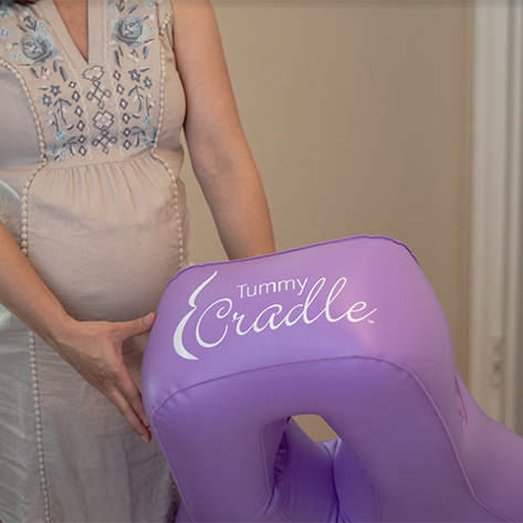 Woman holding Tummy Cradle
